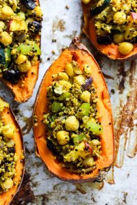 Quinoa stuffed sweet potatoes - a satisfying dinner full of tasty ingredients like chickpeas, raisins, and sweet potato! | The Real Life RD