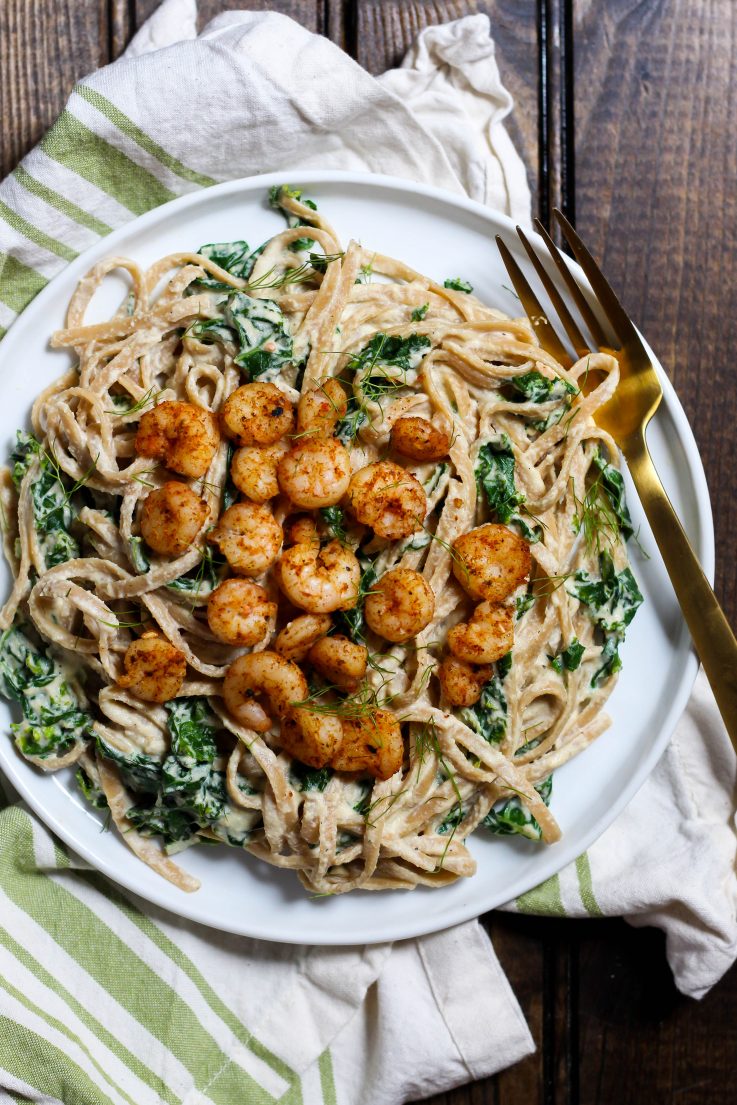 This creamy Shrimp Alfredo is made dairy-free with a delicious cashew sauce! Perfect for a fancy dinner that's actually easy. | The Real Life RD
