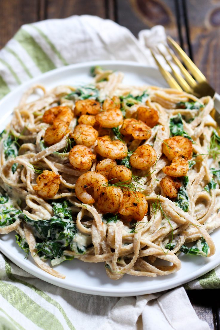 This creamy Shrimp Alfredo is made dairy-free with a delicious cashew sauce! Perfect for a fancy dinner that's actually easy. | The Real Life RD