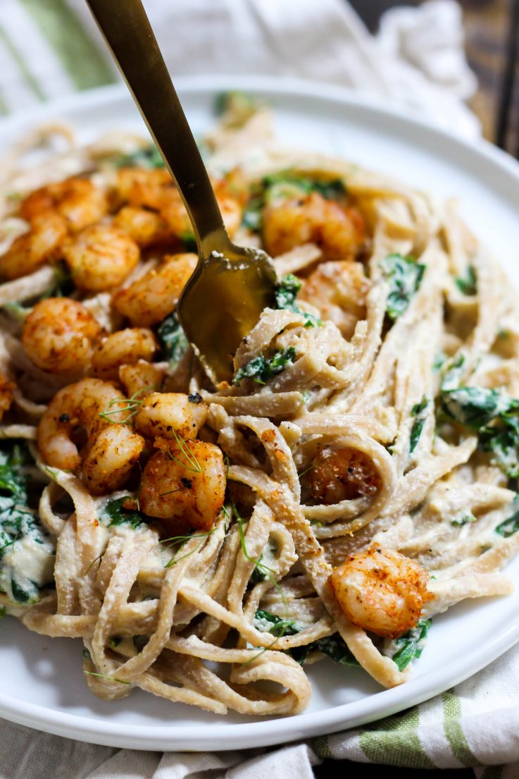 This creamy Shrimp Alfredo is made dairy-free with a delicious cashew sauce! Perfect for a fancy dinner that's actually easy. | The Real Life RD